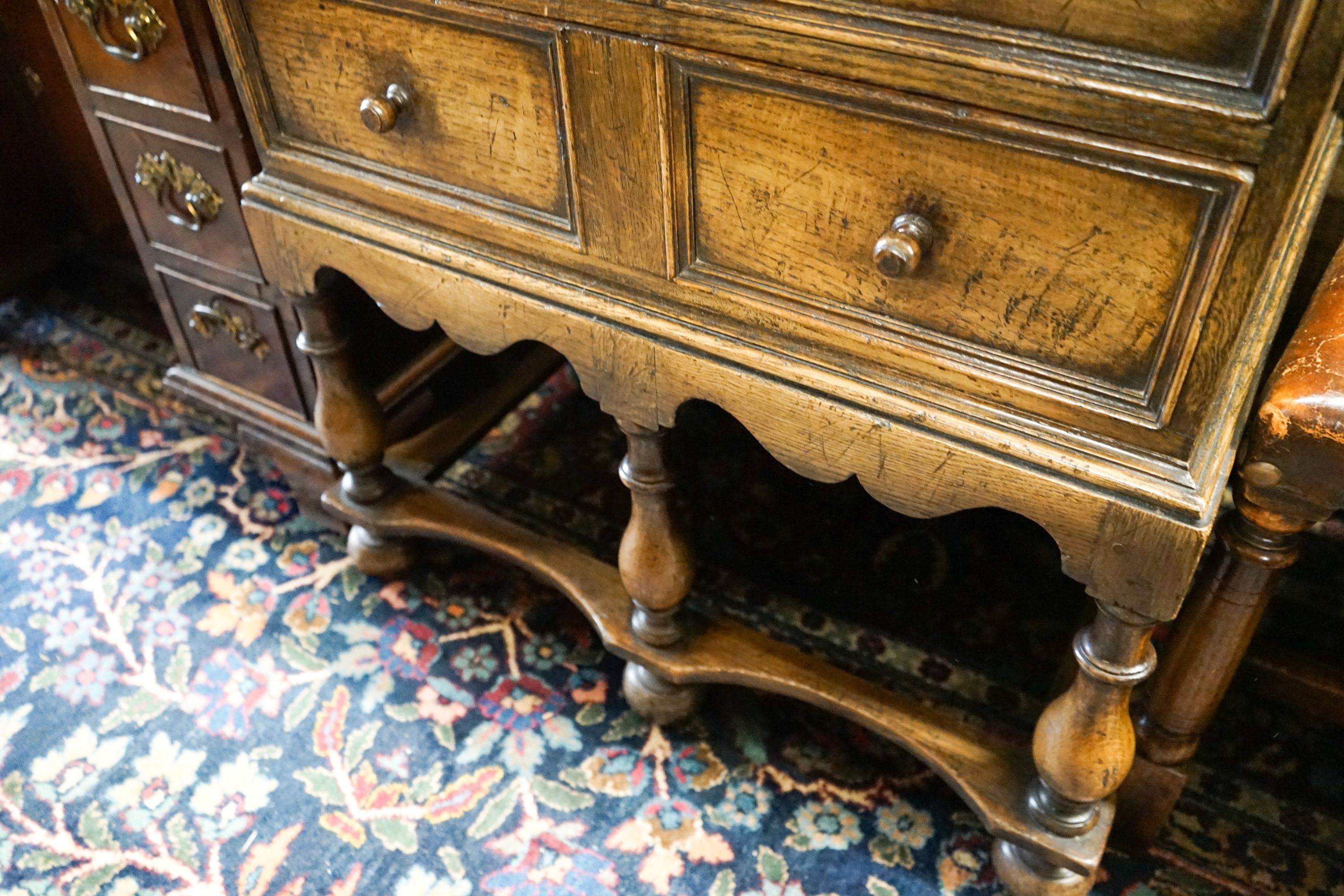 A 17th century style small oak chest on stand